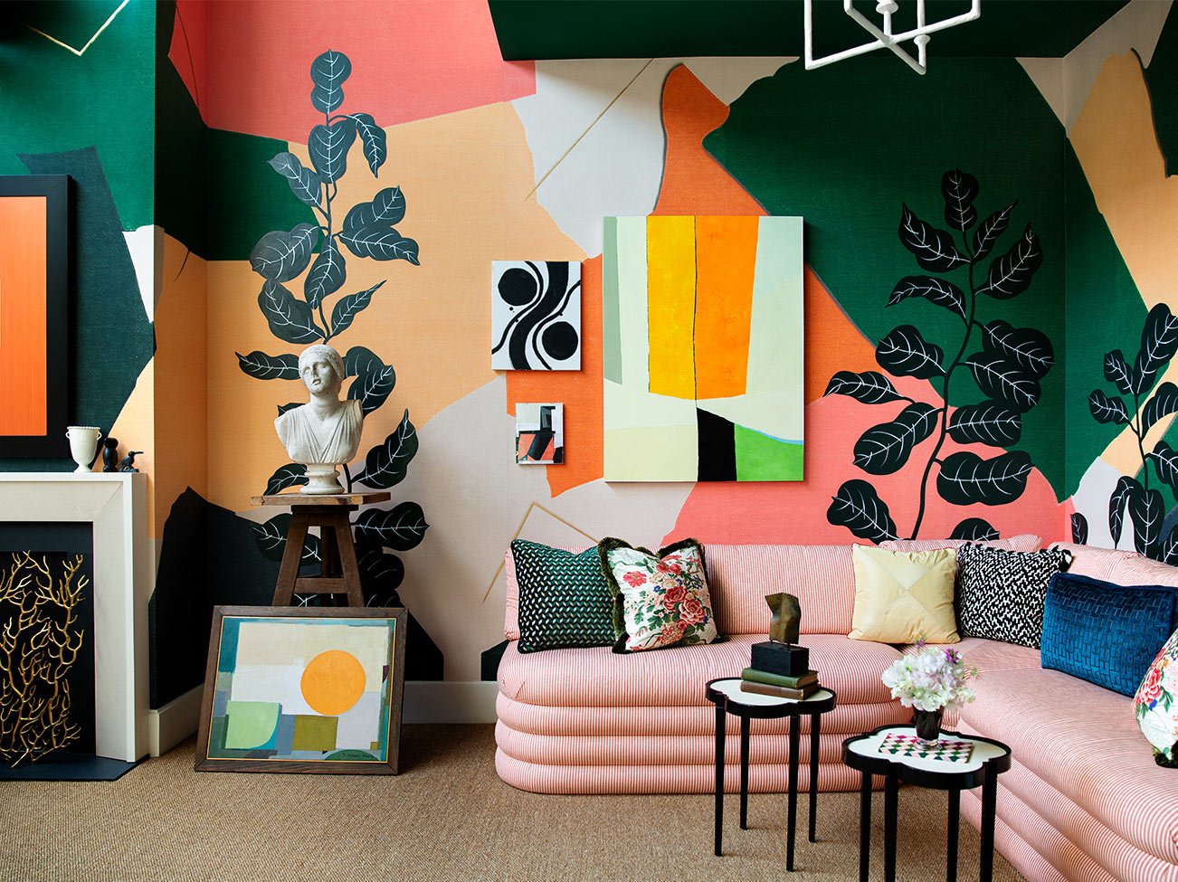 Young Huh's Kip Bay Show House 2019:  Artist's loft with pink couch and multi-coloured abstract walls painted in a range of Benjamin Moore colours.