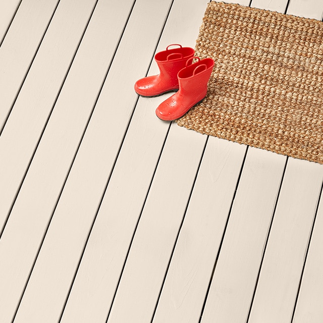 A deck stained with Maritime White OC-5 Solid Woodluxe® Exterior Stain.