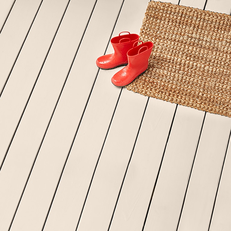 A deck stained with Maritime White OC-5 Solid Woodluxe® Exterior Stain.