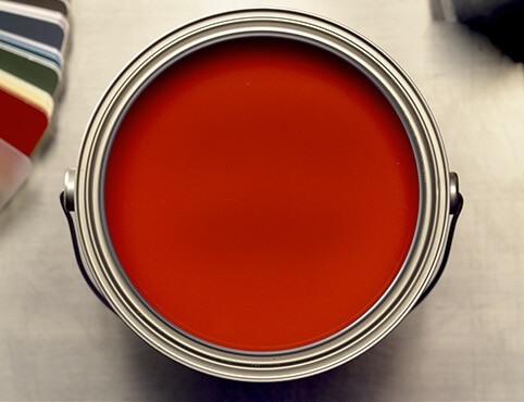 An open can of red paint